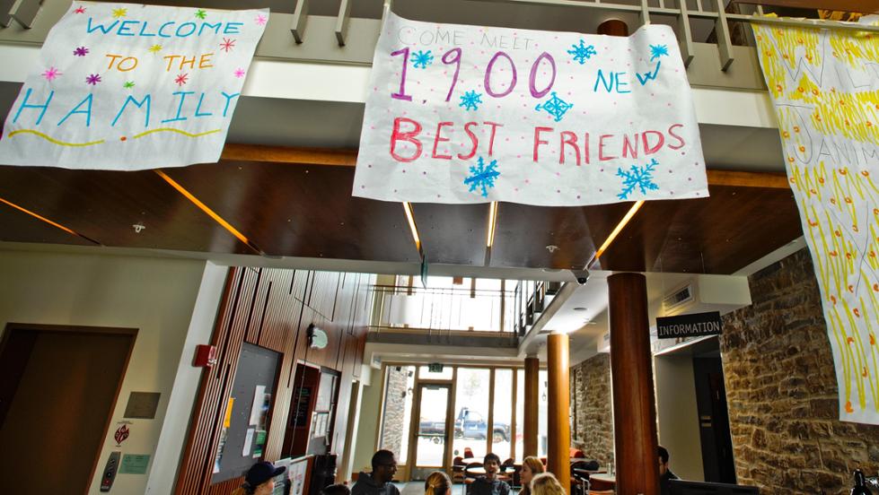 Large banners greet incoming January admits at the registration desk in the Sadove Student Center.