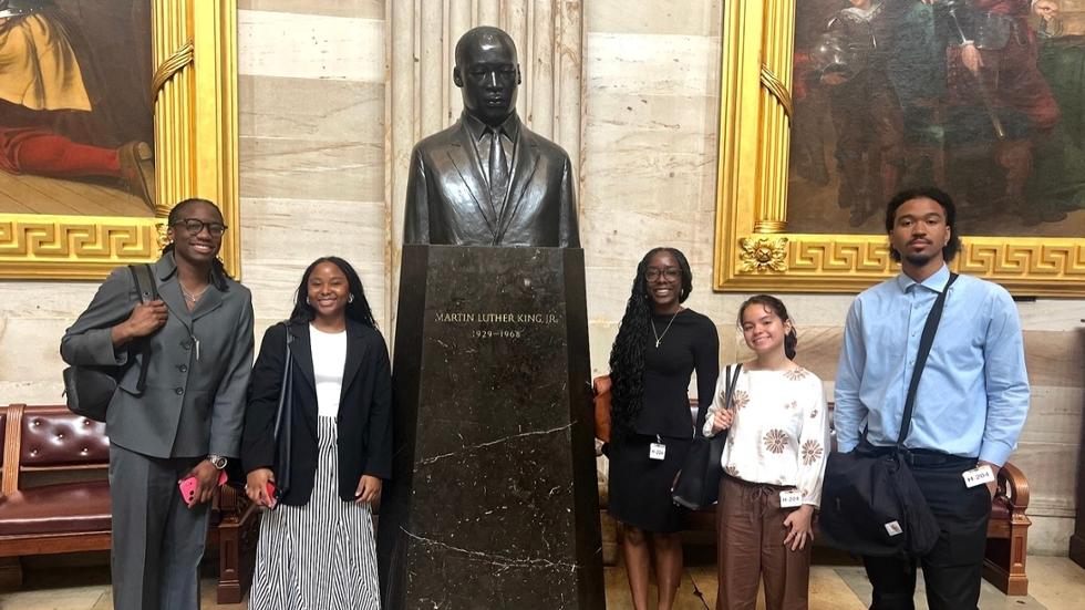 Jasmine Bonilla '28, second from right, and fellow National Urban League Washington bureau summer advisors in front of the Martin Luther King Jr. memorial in the U.S. Capitol.