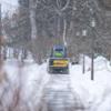 Clearing the walkways on campus after a snowfall.