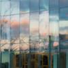A sunset reflected in the windows of KTSA on a winter day.