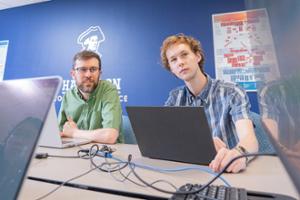 Professor of Computer Science Tom Helmuth and Owen Dennen &rsquo;28 work on their summer research project.