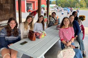 First-Year Experience (FYE) leader Dana Blatte &rsquo;26 with first-years at Northstar Orchards.