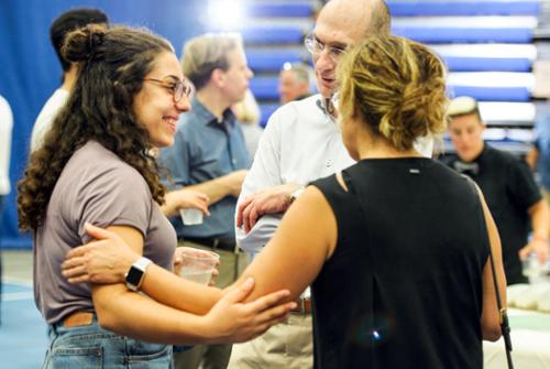 President Wippman speaks with a student and her mother