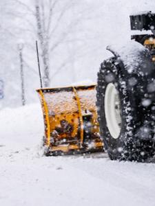 A close-up of a snow plow on campus.
