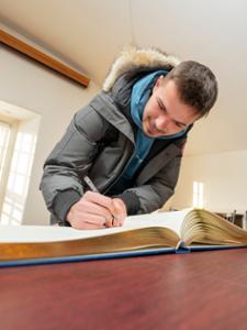 Signing the college register, a Hamilton tradition.