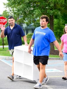 Robert Gregor &rsquo;30 heads to his dorm with items he grabbed at the Cram & Scram.