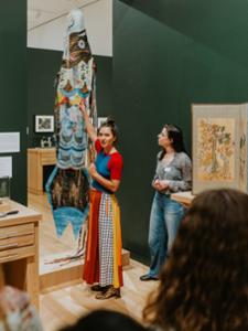 A class explores the Menagerie exhibition at the Wellin.