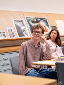 Will Kretz '26 talk with Wellin staff about purchasing an artist's work to be displayed in the Wellin Museum of Art.