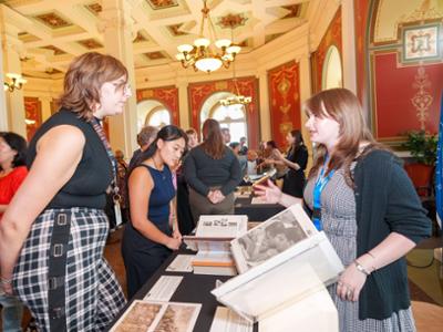 Olivia Piersall ’27 presents a collection of newspapers covering the September 11 attacks at the Library of Congress.