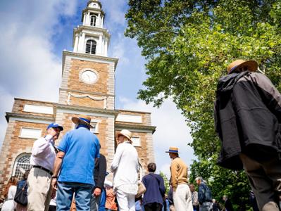alumni gather outside the chapel