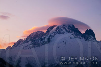 Lenticular cloud on mountain summit