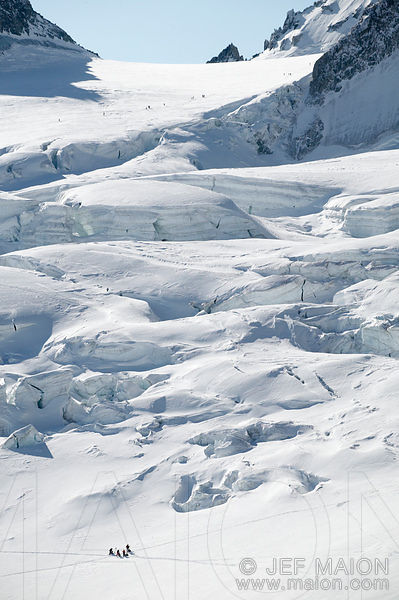 Skiers and glacier