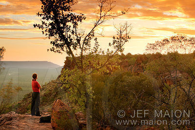 Woman watching spectacular sunset