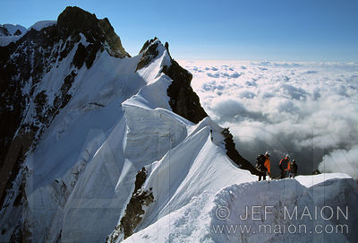 Climbers on a knife-edged ridge
