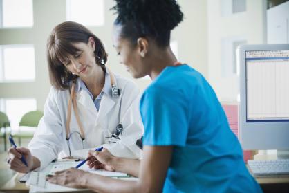 Doctors Filling Out Paperwork