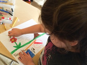 Evian Cloud works on a drawing for Earth Day.