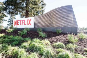 Netflix adds record new subscribers, shares surge