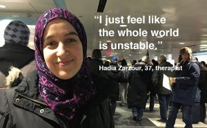 Hadia Zarzour, a Muslim Syrian protests Sunday at Chicago O'Hare International Airport Sunday. (Shen Lu/MEDILL)