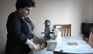 Marzie bakes cookies to sells in Iranian new year (Nowruz) market (Fatemeh Jamalpour/Medill)