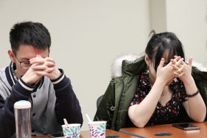 Players close their eyes “at night” when the moderator calls the roles that have abilities to perform their special action. (Xiaozhang (Shaw) Wan/MEDILL