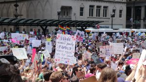 Demonstrators gather at Richard J. Daley Center before the march.