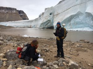 Paleoclimatologist Brendan Reilly and PhD student Anna Glueder collect rock and sediment samples near the Petermann Glacier in northwest Greenland. (Brendan Reilly/Oregon State University)