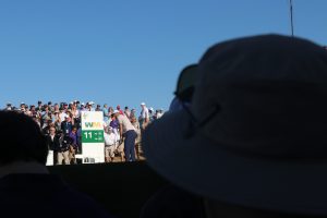 Scottie Scheffler tees off from the 11th hole while crowds watch on Feb. 6, 2025. (Simone Roberts/MEDILL)