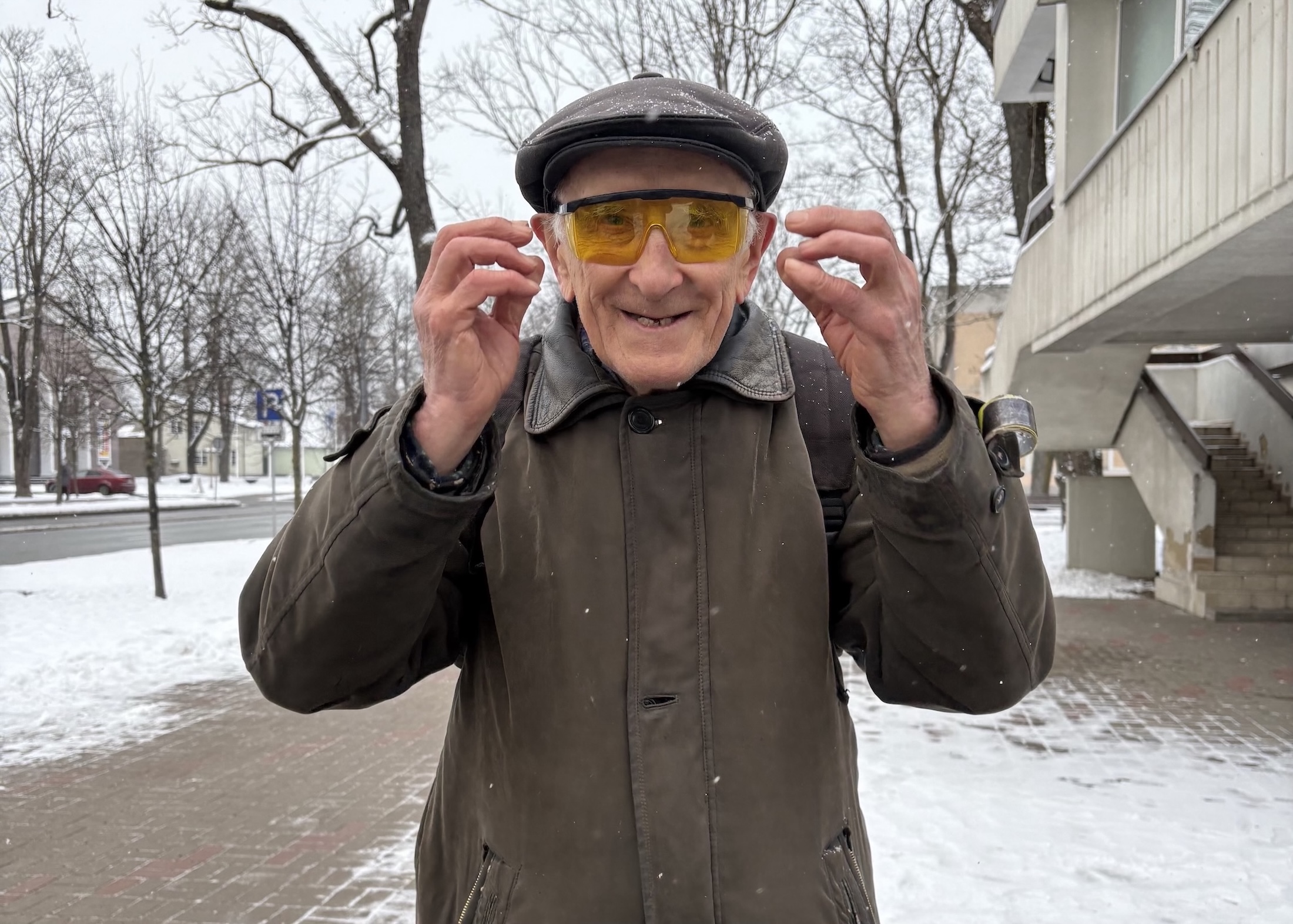 Edward adjusts his glasses to prepare to have his portrait taken (Maggie Dougherty/MEDILL).