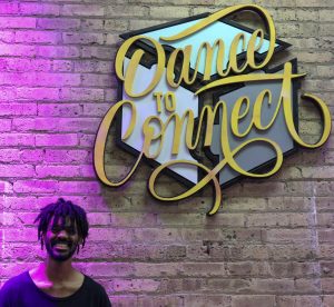 Brandon Jackson in front of dance studio sign