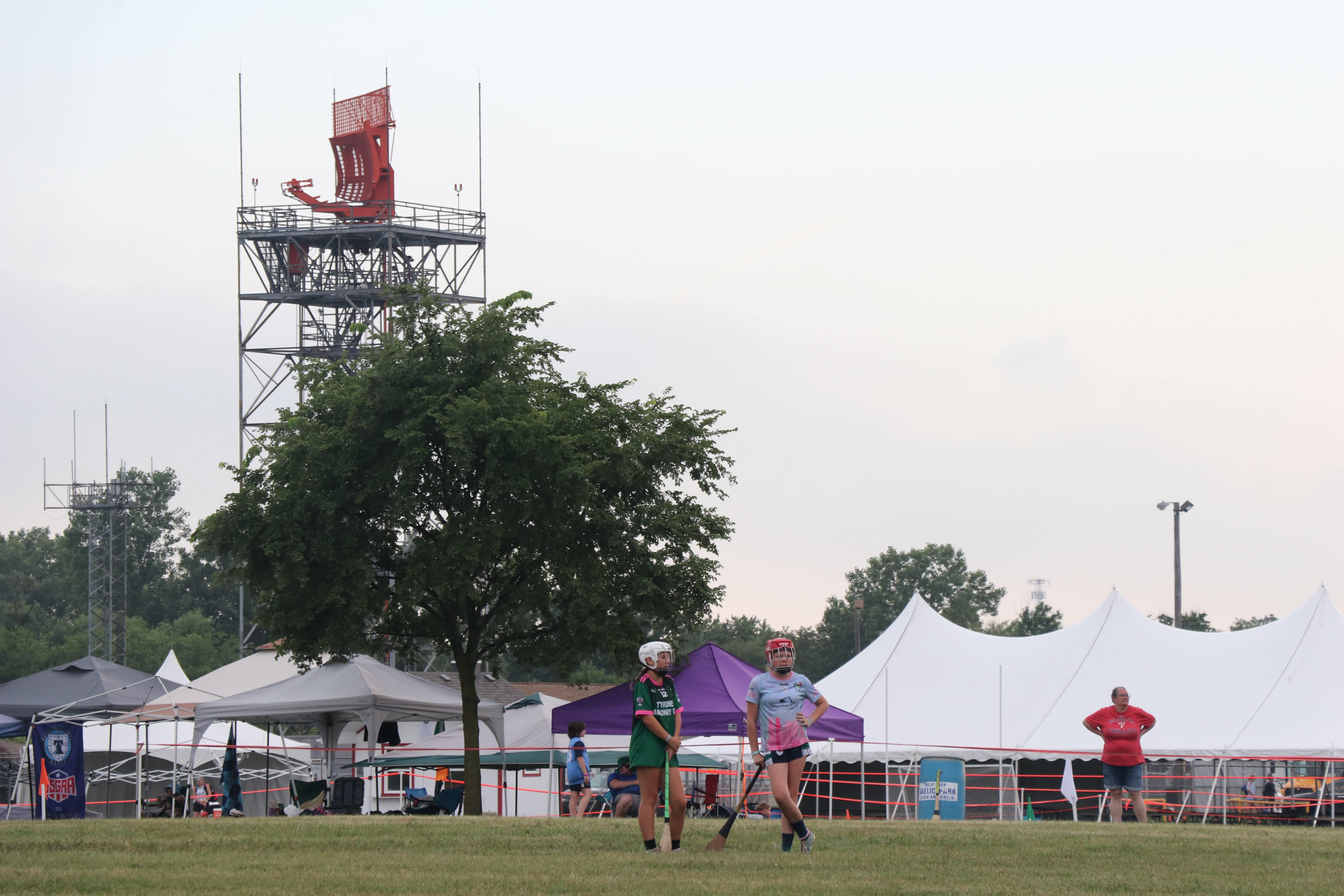 Two players from opposing teams chat during a camogie game at the Continental Youth Championships at Chicago Gaelic Park in Oak Forest (Photo: Tom O'Connor)