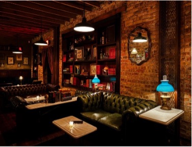 Interior of The Meadowlark, a cozy Chicago bar with leather seating