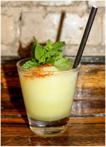 Singani cocktail with mint garnish