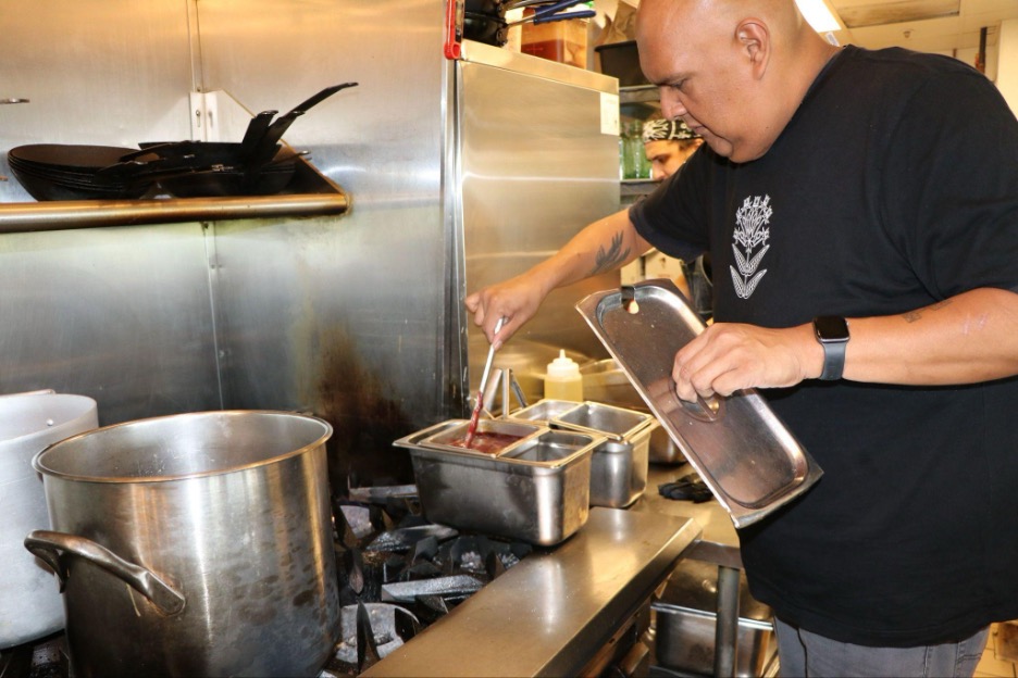 Chef preparing Native food on stovetop