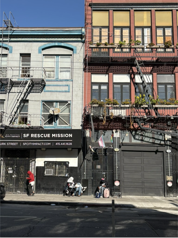 SF Rescue Mission building and people on sidewalk.
