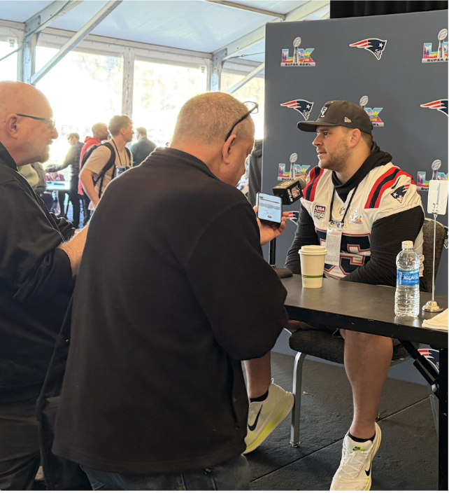 Football player being interviewed at Super Bowl event