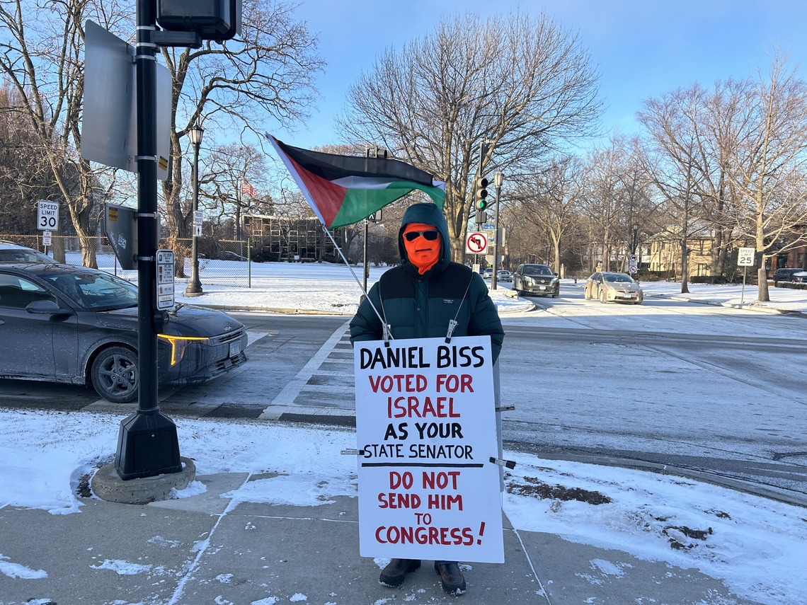 Protester with sign: "Daniel Biss voted for Israel as your state senator."