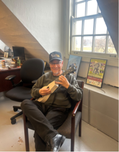 Orlando Rivera, executive director and co-founder of the Chicago Cuatro Orchestra in Humboldt Park, strums a five-string tiple, a cousin of the cuatro instrument, on Jan. 8, 2026, at Humboldt Park Fieldhouse.