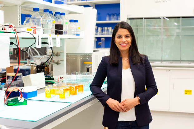 Researcher in lab with artificial cells.