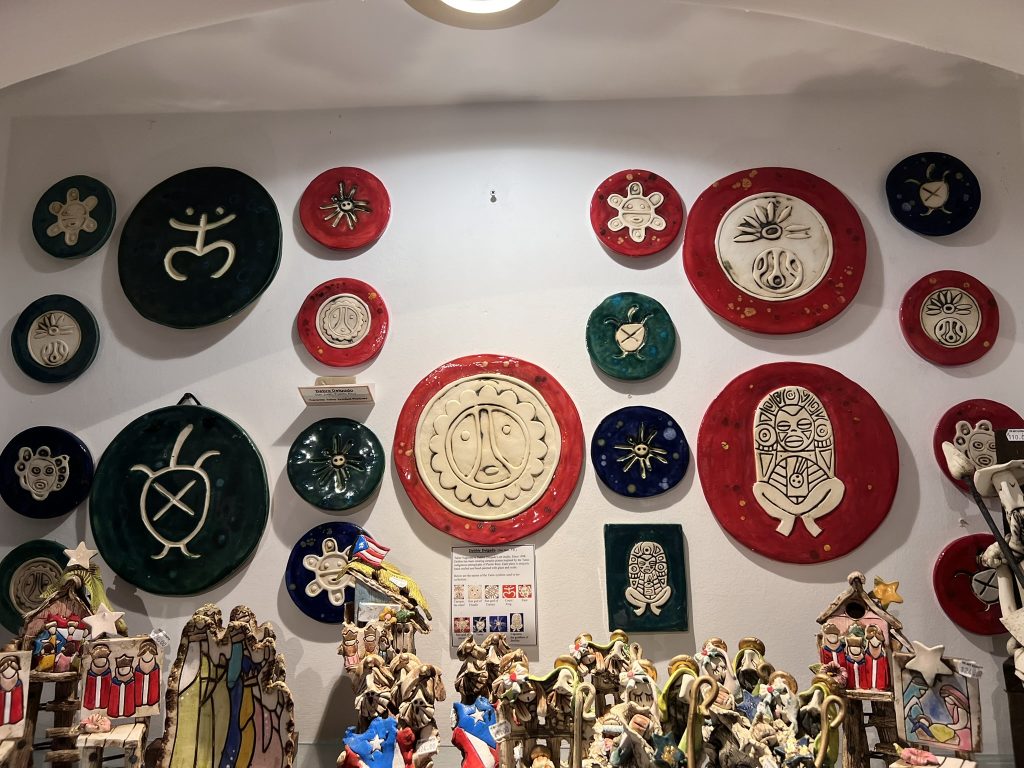 Colorful Taíno symbol art in Puerto Rican souvenir stores.