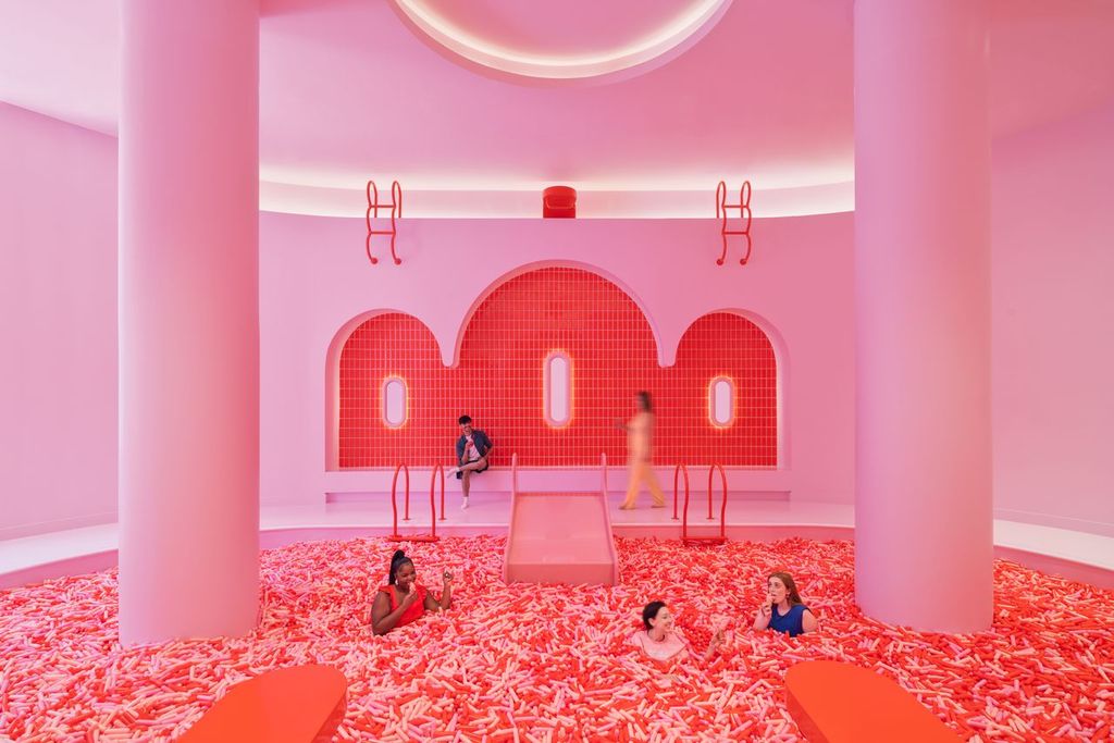 Pink ball pit with people
