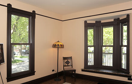 Bay window with antique lamp and chair