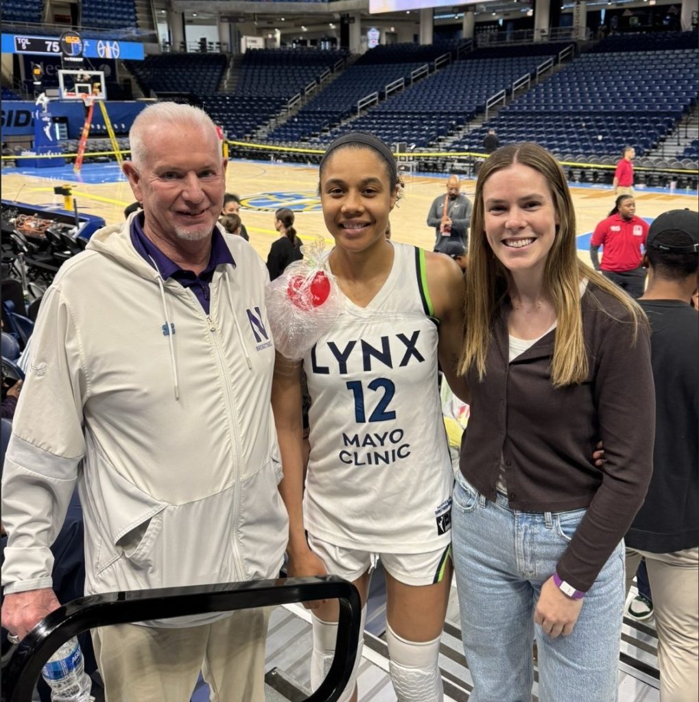 Former Northwestern women’s basketball coach Joe McKeown, left, and current assistant coach Maggie Lyon, right, caught up with Minnesota Lynx player and Northwestern alum Nia Coffey after the Chicago Sky game May 23. Days later, Lyon returned to watch her former teammate score a season high 20 points in a 79-58 win May 29. (Photo courtesy of Joe McKeown)