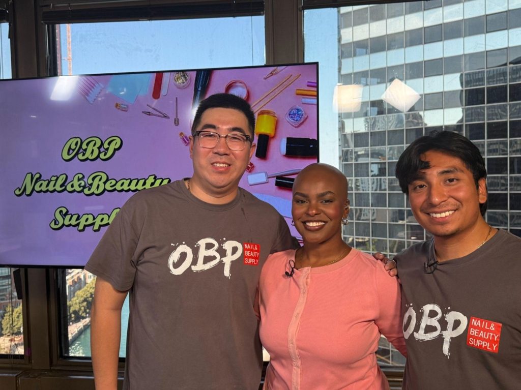 Nick Liu and Eric Gonzalez visit the 303 E. Wacker Drive studio July 7 to show Morgan Norris how to master press-on nails. (Morgan Norris/MEDILL)