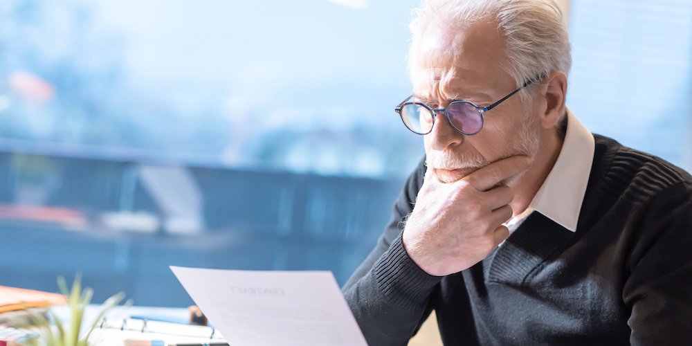 Senior businessman reading a document