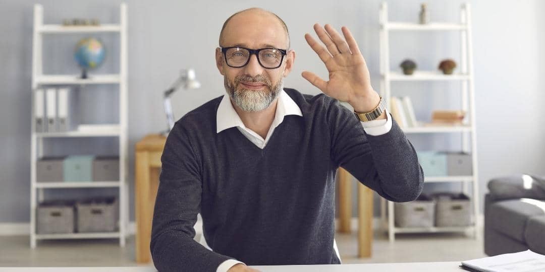 Mentor waving at camera - have a mentor contact you