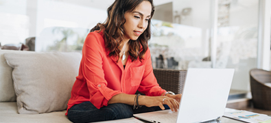 A woman using her laptop to search for resources
