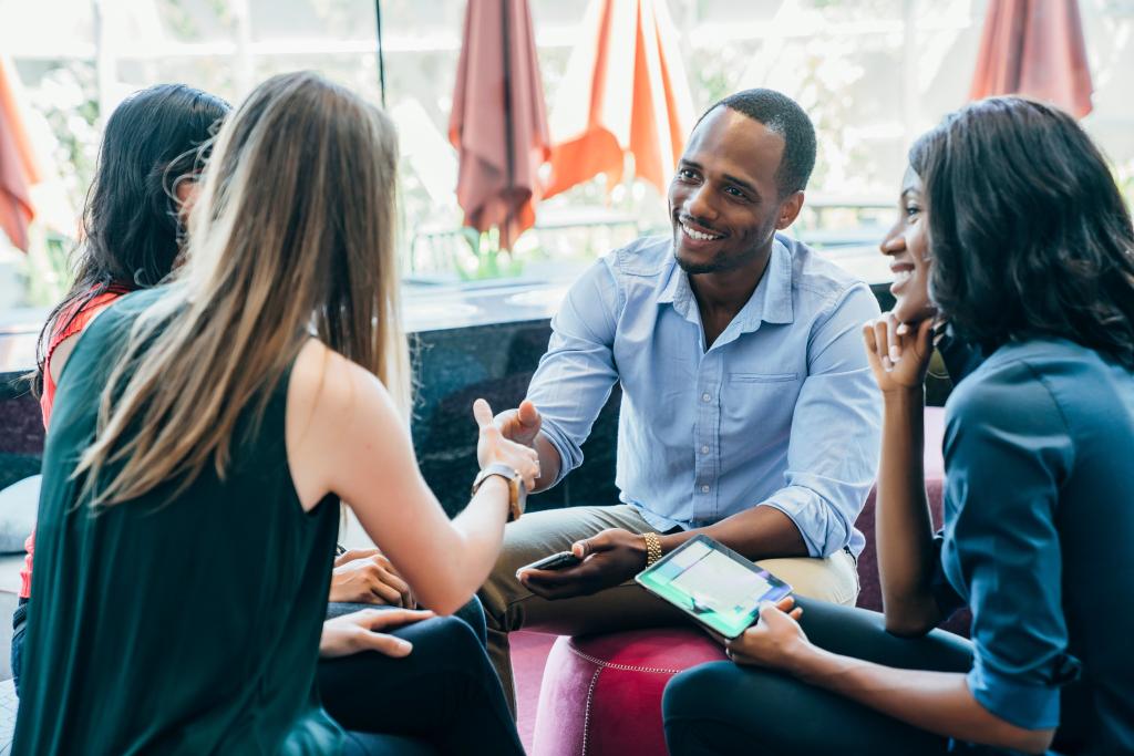Four people meeting eachother.