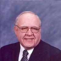 Photo of Darold Berreau Business Picture of Darold Berreau in a navy blue suit and tie
