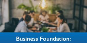 Entrepreneurial team meeting about business start up with light bulb in the foreground of the image