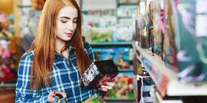 Beautiful girl with long brown hair shopping at store